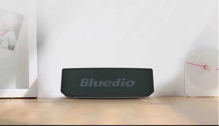 BS-6 black compact rectangular Bluetooth smart speaker on a surface.