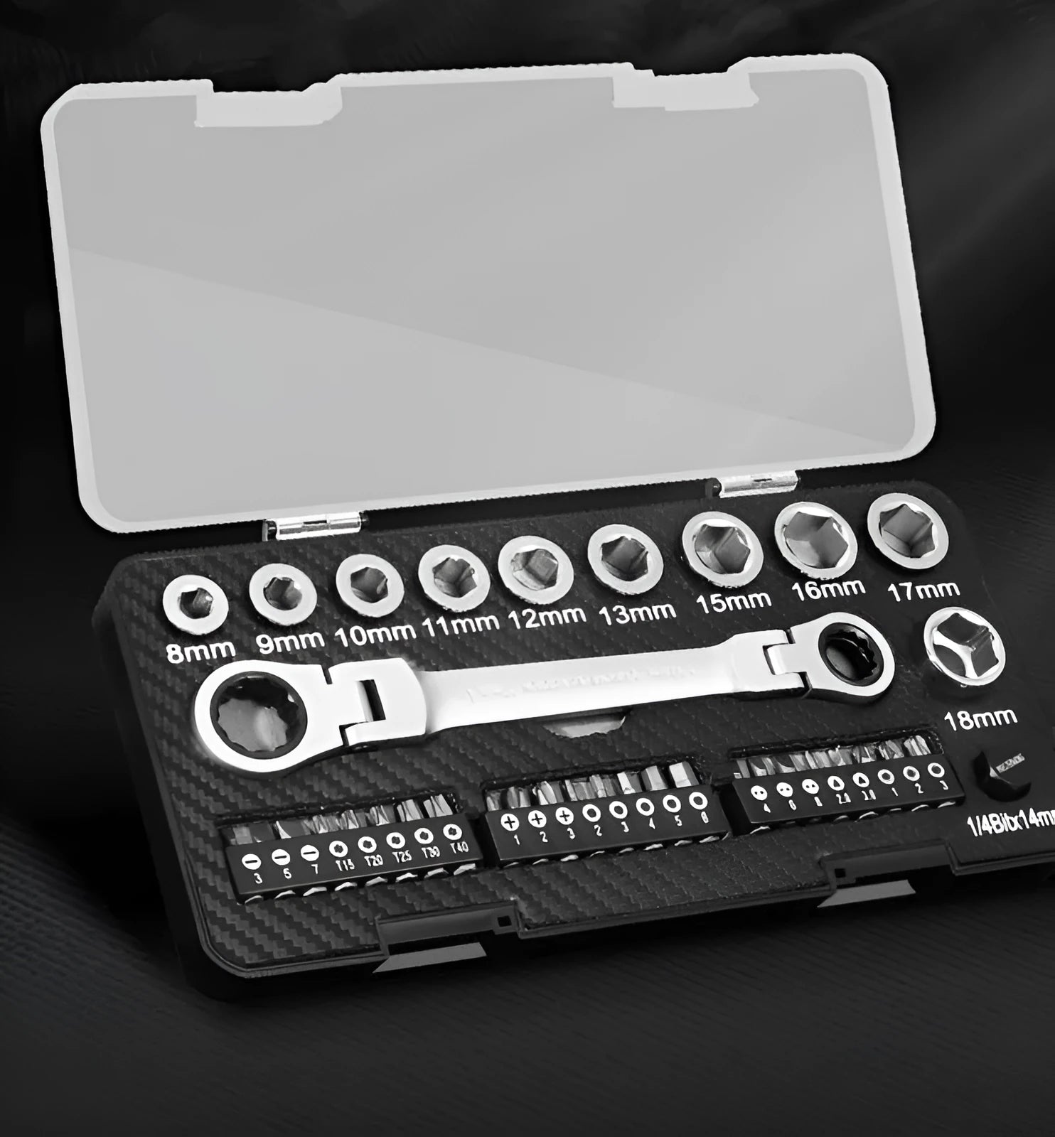 Ratchet wrench set with two-way ratchet mechanism, ten sockets, and three bit heads laid out on a surface