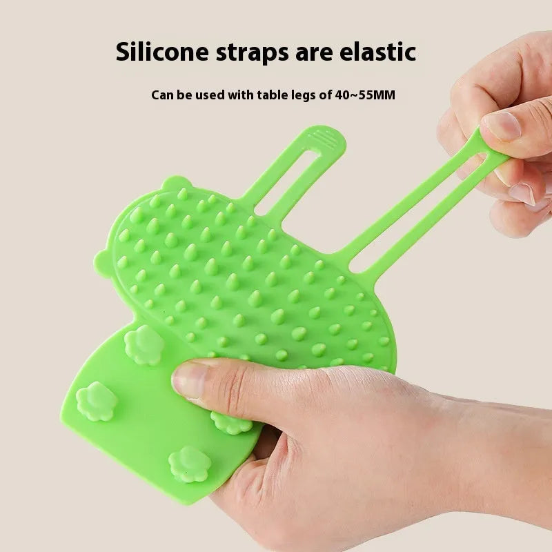 Silicone cat grooming massage comb with rounded teeth and adjustable mounting strap in assorted colours