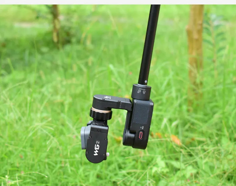 Black retractable selfie stick with hand-held stabiliser extended for smartphone photography