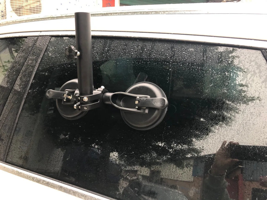 Black off-road car sucker mount with rubber suction cup for attaching flags to vehicle windows.