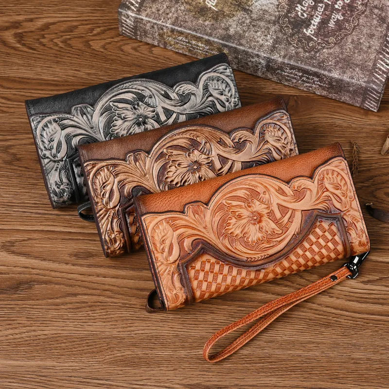 Women's brown genuine leather tri-fold wallet with embossed floral pattern showing interior compartments