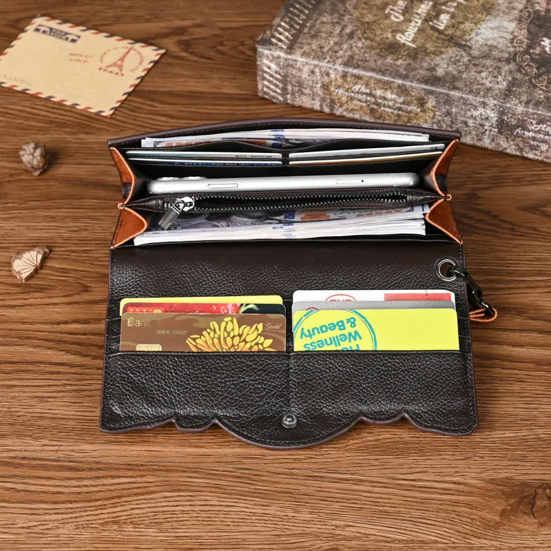 Women's brown genuine leather tri-fold wallet with embossed floral pattern showing interior compartments