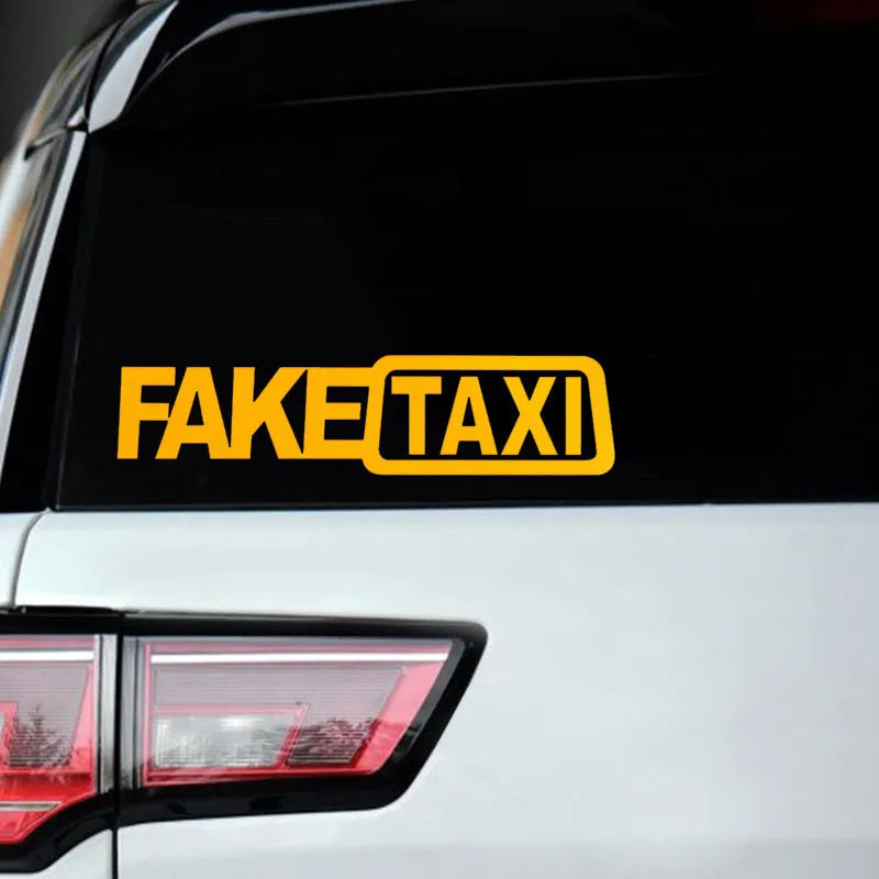 Black Fake Taxi car window sticker on glass, showing waterproof PET material and 20cm by 8cm size.