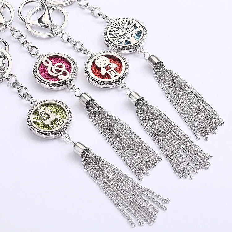 Alloy tassel car pendant with chain hanging, showing 12mm diameter fragrance compartment and coloured cotton inserts