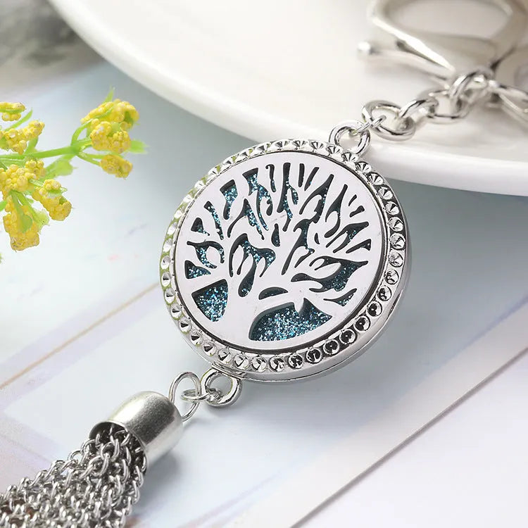 Alloy tassel car pendant with chain hanging, showing 12mm diameter fragrance compartment and coloured cotton inserts