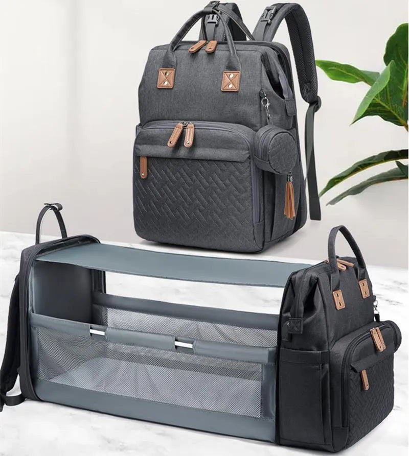 Oxford baby diaper backpack in black with vertical square shape, soft handles, and visible sewing lines