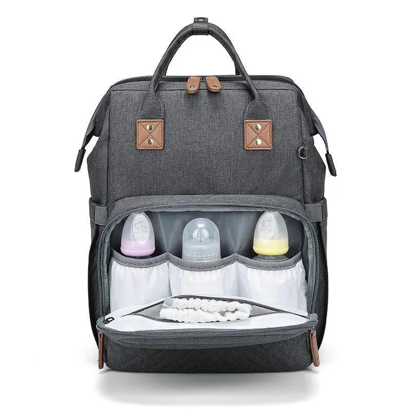 Oxford baby diaper backpack in black with vertical square shape, soft handles, and visible sewing lines