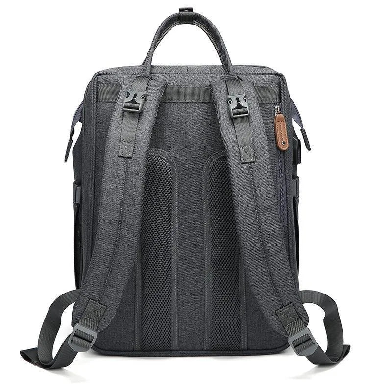 Oxford baby diaper backpack in black with vertical square shape, soft handles, and visible sewing lines