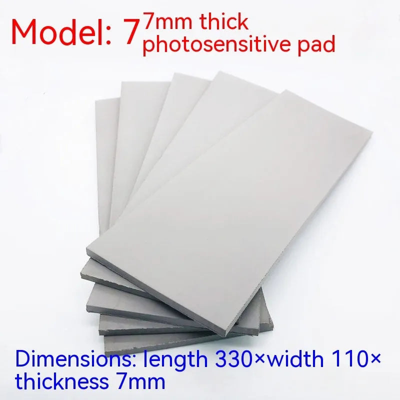 Black and gray plastic light-sensitive mat for seal pottery and calligraphy, showing 330mm by 110mm sheet.