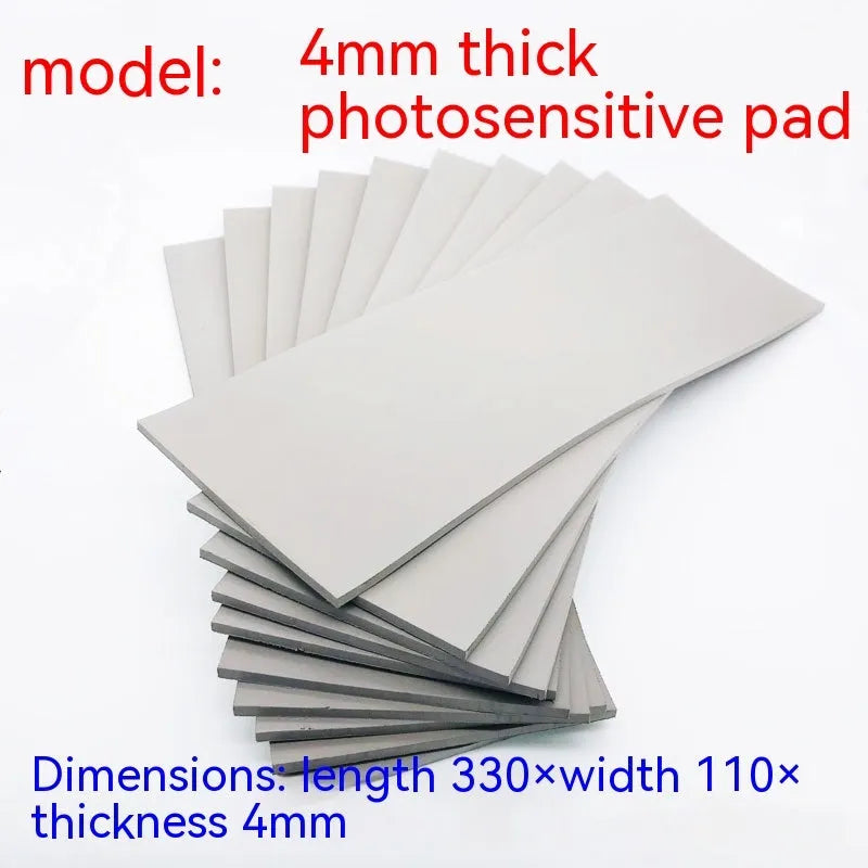 Black and gray plastic light-sensitive mat for seal pottery and calligraphy, showing 330mm by 110mm sheet.