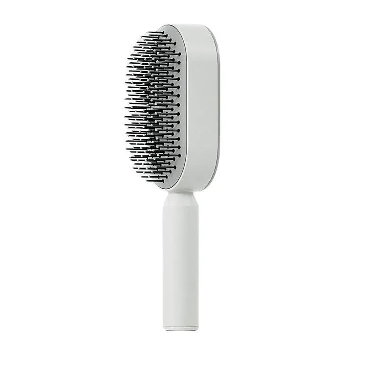 Automatic cleaning hair comb with 3D air cushion in pink, measuring 25x7x5cm, with ergonomic handle for scalp massage