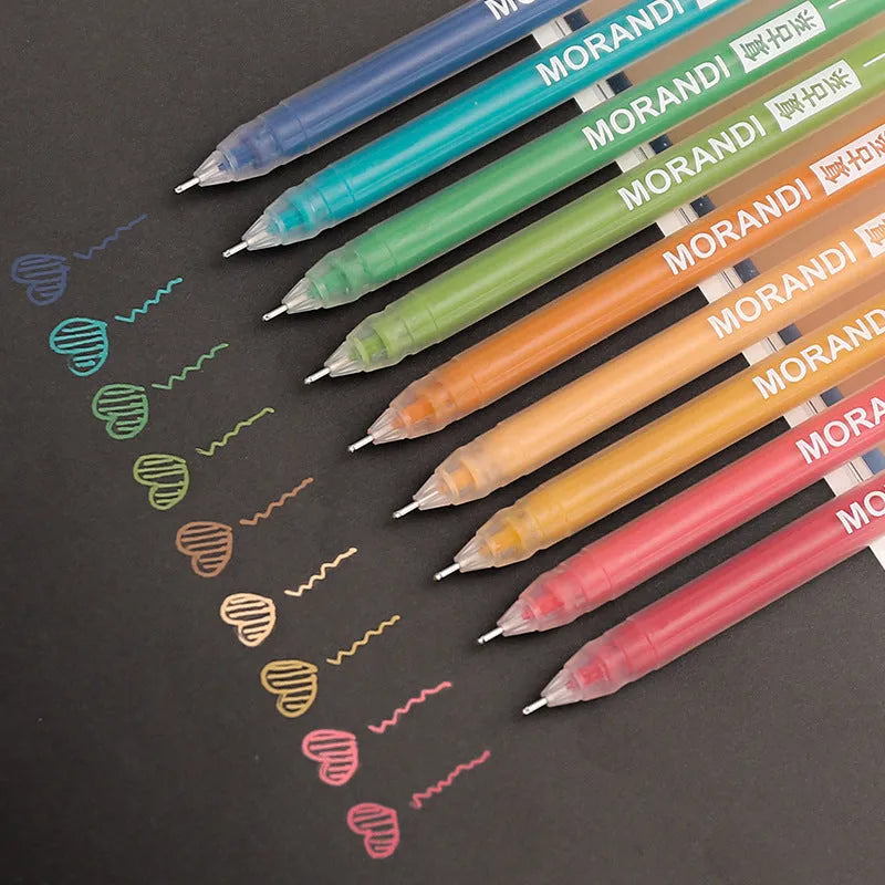 Set of nine colourful retro gel pens with 0.5mm needle tips, shown alongside a notebook.