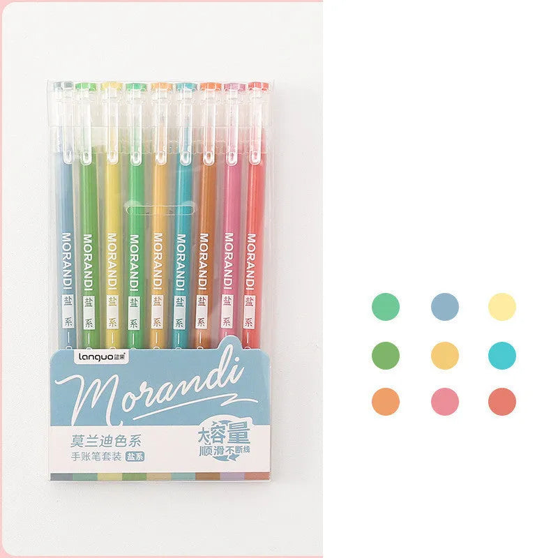 Set of nine colourful retro gel pens with 0.5mm needle tips, shown alongside a notebook.