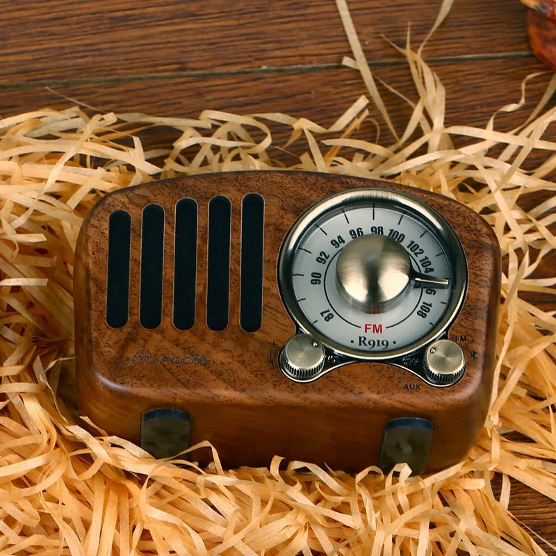 Retro wooden wireless mini speaker in cherry wood or walnut finish, showing compact size