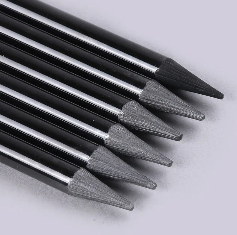 Set of nine wooden drawing pencils on a suction card, containing six graphite and three carbonized pencils for artist sketching.