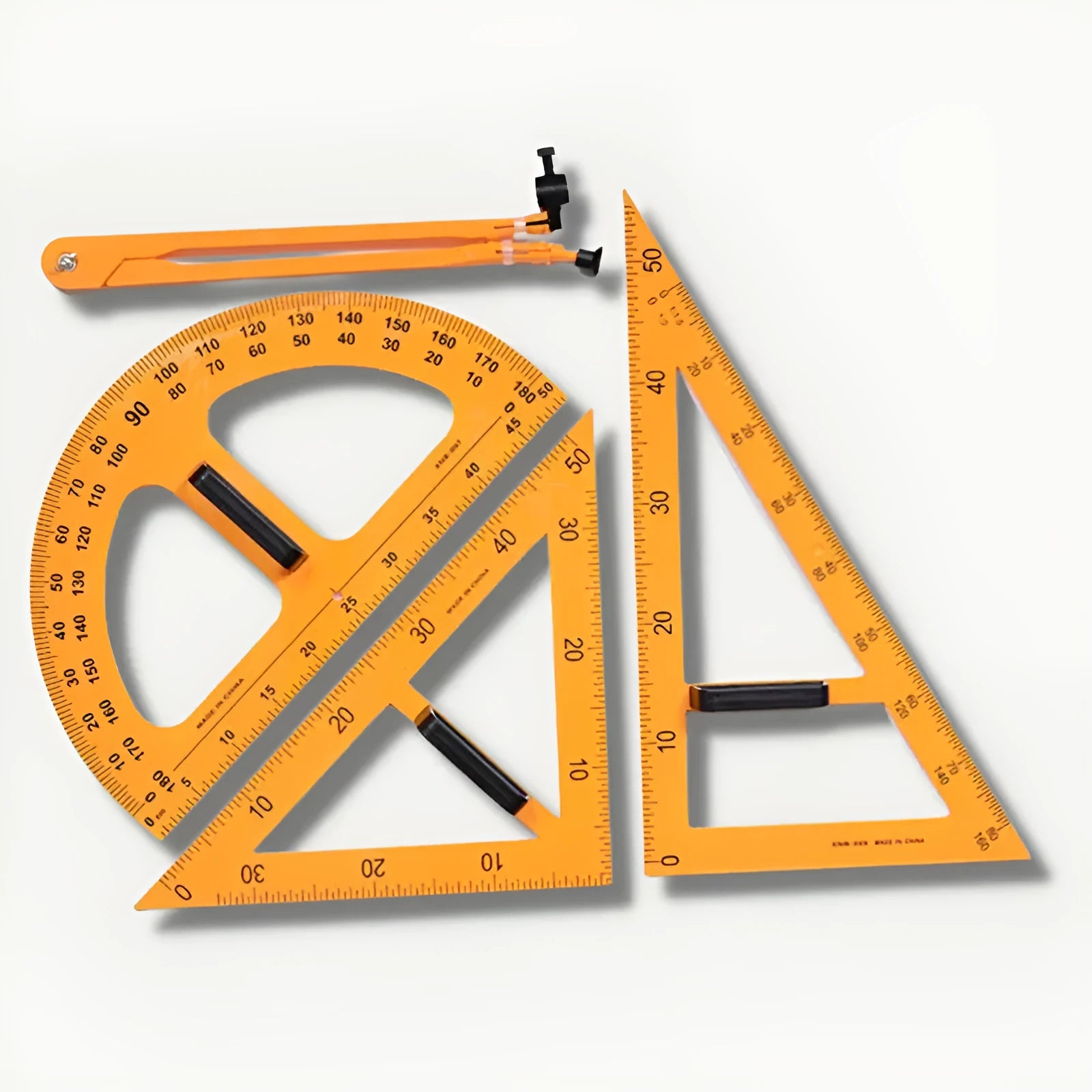 Mathematics teaching tools set with orange and black triangle rulers, protractor and chalk compass