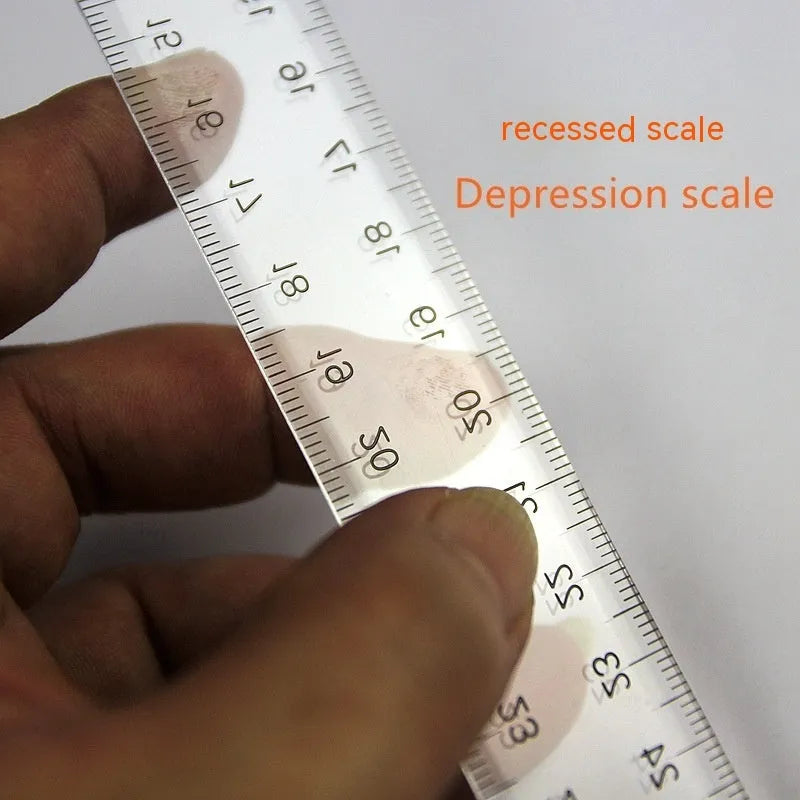 Transparent and orange yellow plastic T-shaped rulers with British and double centimetre scale markings