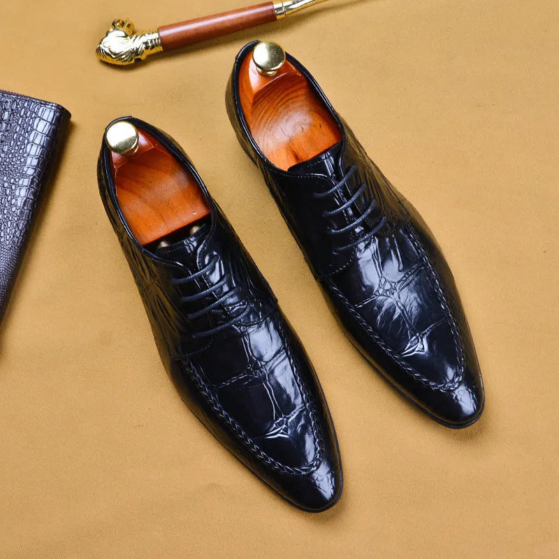 Men's black and brown British-style leather shoes with alligator grain and a horse bit buckle.