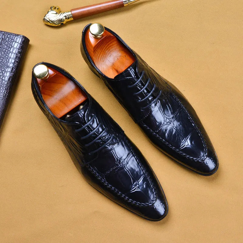 Men's black and brown British-style leather shoes with alligator grain and a horse bit buckle.