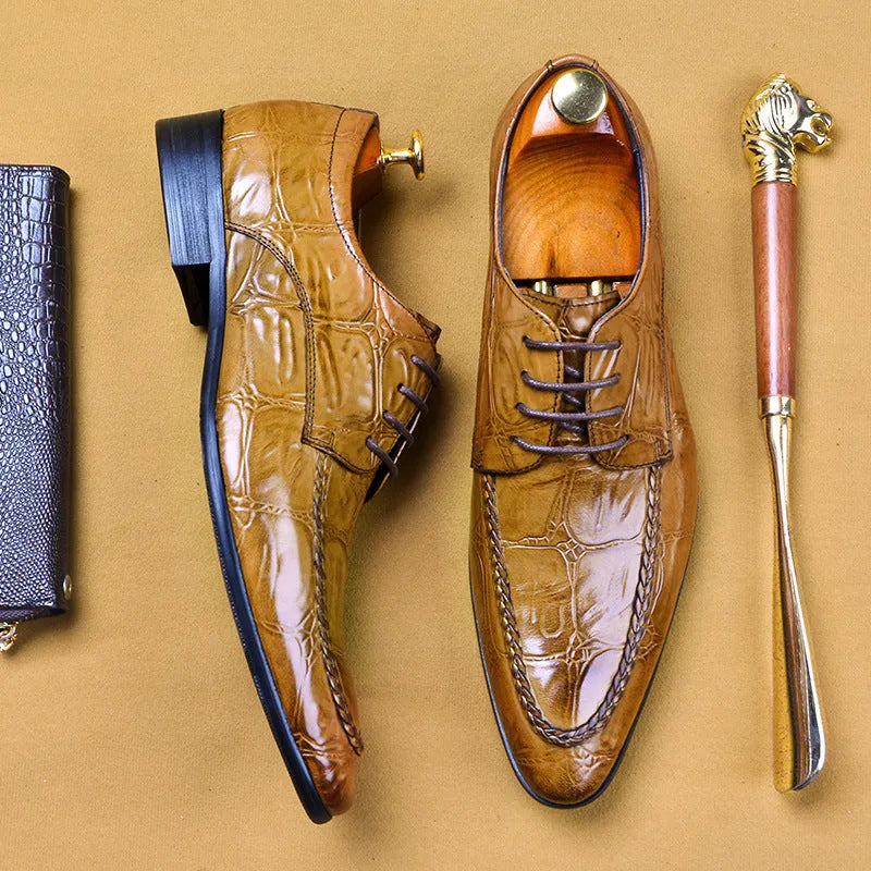 Men's black and brown British-style leather shoes with alligator grain and a horse bit buckle.