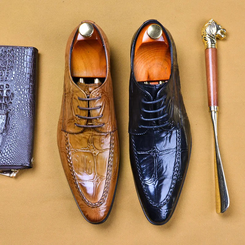 Men's black and brown British-style leather shoes with alligator grain and a horse bit buckle.