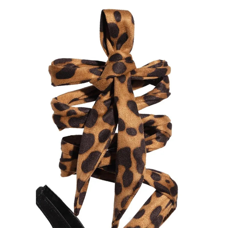 Light brown leopard print Roman sandals with cross-straps and above 8cm heel