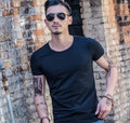 Men's polyester summer T-shirt on a hanger, available in multiple colours.
