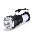 Black solar-powered and USB-rechargeable LED emergency flashlight with press switch.