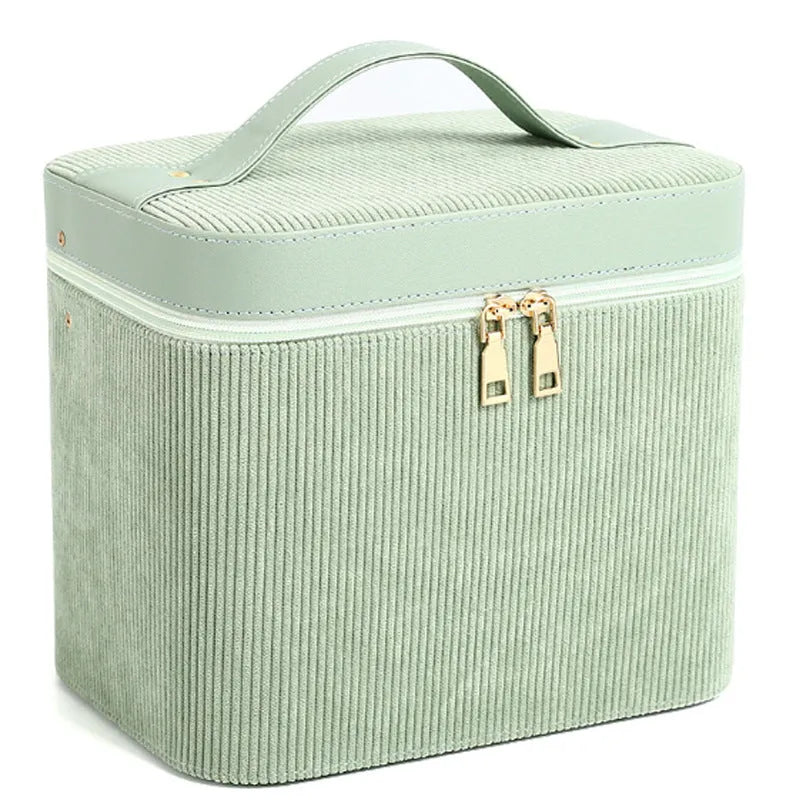 Corduroy cosmetic storage case in a choice of colours, showing large capacity interior with lining.