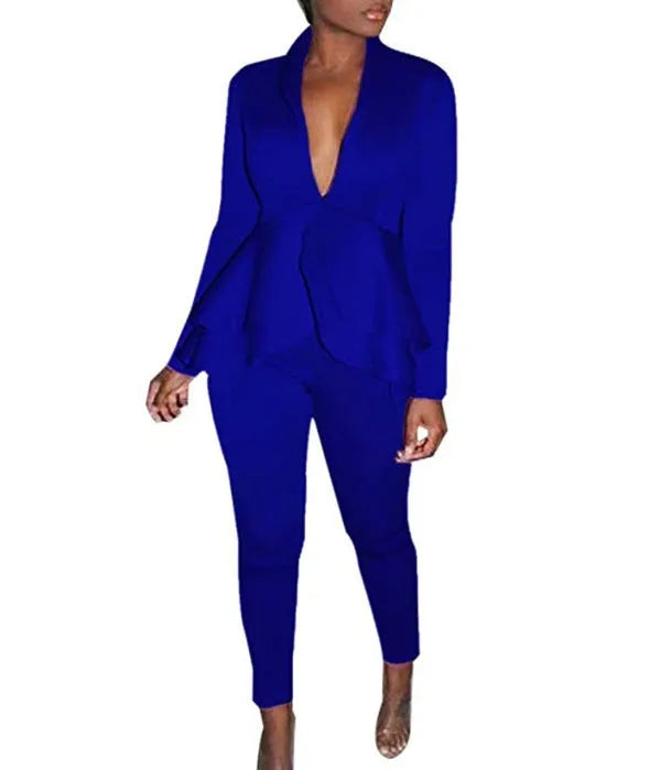 White ruffled business casual shirt and matching pencil pants set laid flat.