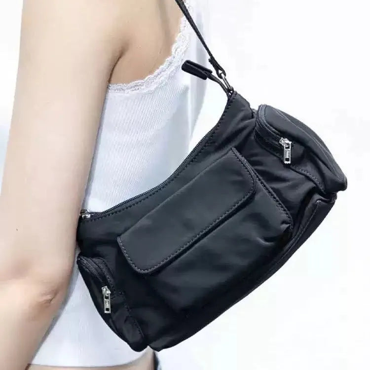 Black PU women's shoulder bag with double pockets showing side line detail, 24cm length