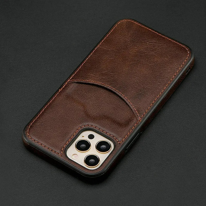 Dark blue PU leather protective phone case for iPhone on a table.