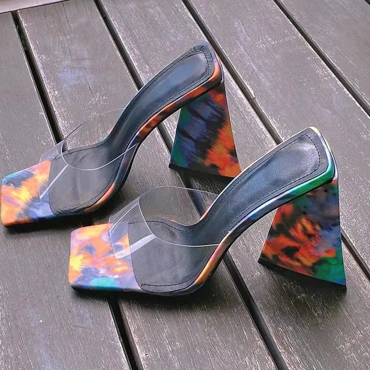 Women's black square toe slippers with a thick triangular heel on a rubber sole.