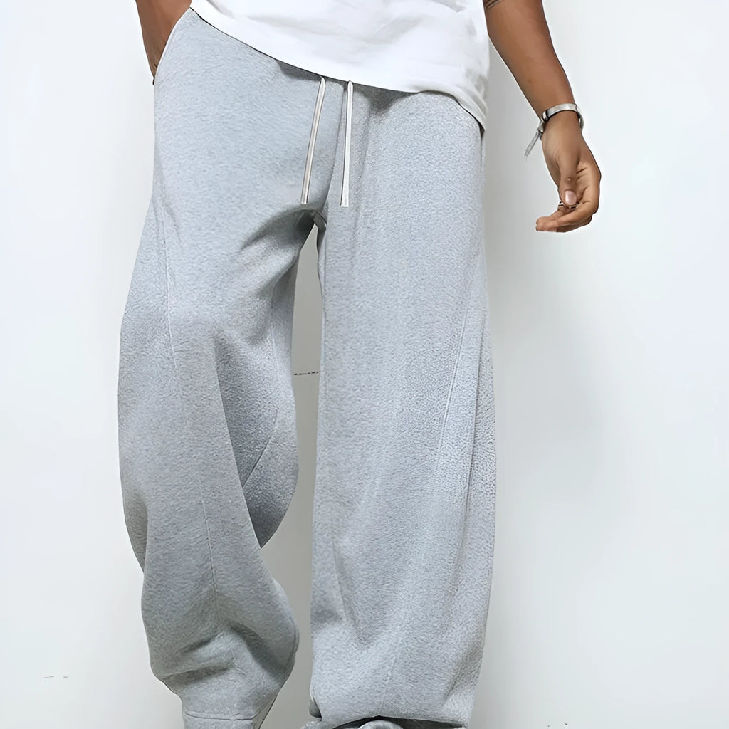 Men's straight-leg casual trousers in polyester fabric with drawstring waist in solid colour options
