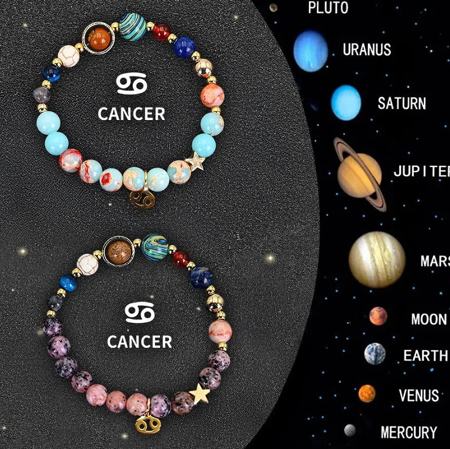 Two natural stone beaded bracelets showing zodiac sign designs on dark background