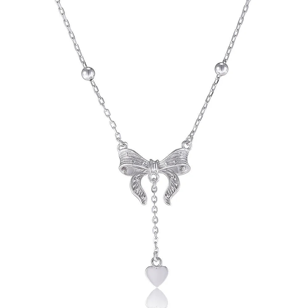 Silver butterfly heart pendant necklace with bow detail on O-ring chain