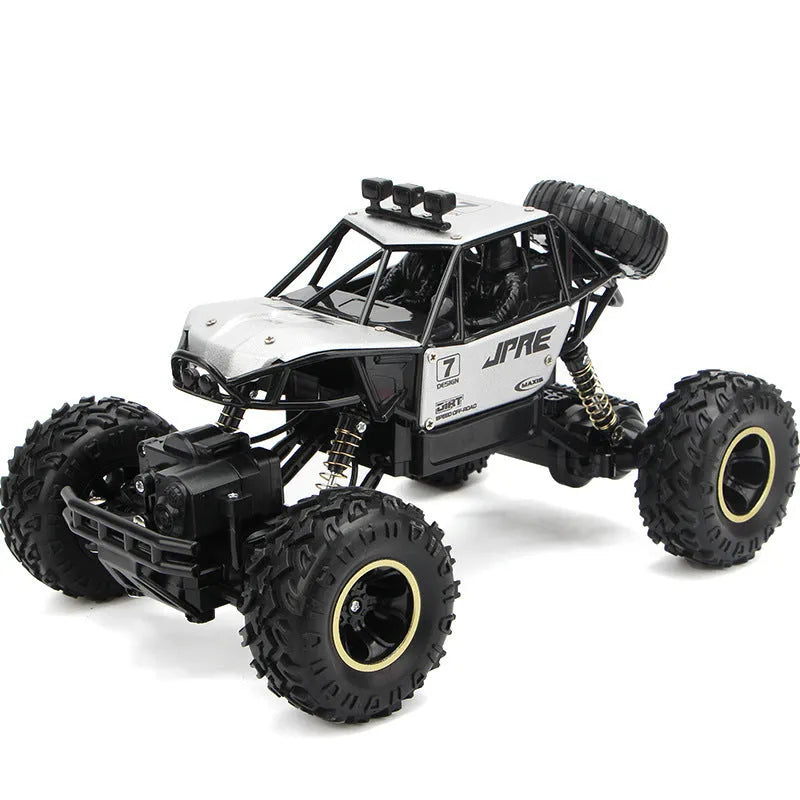 Large black 4WD remote control climbing car on rough terrain with wireless controller