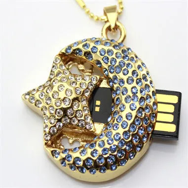 Xingyue jewellery-shaped metal USB flash drive on a white background.