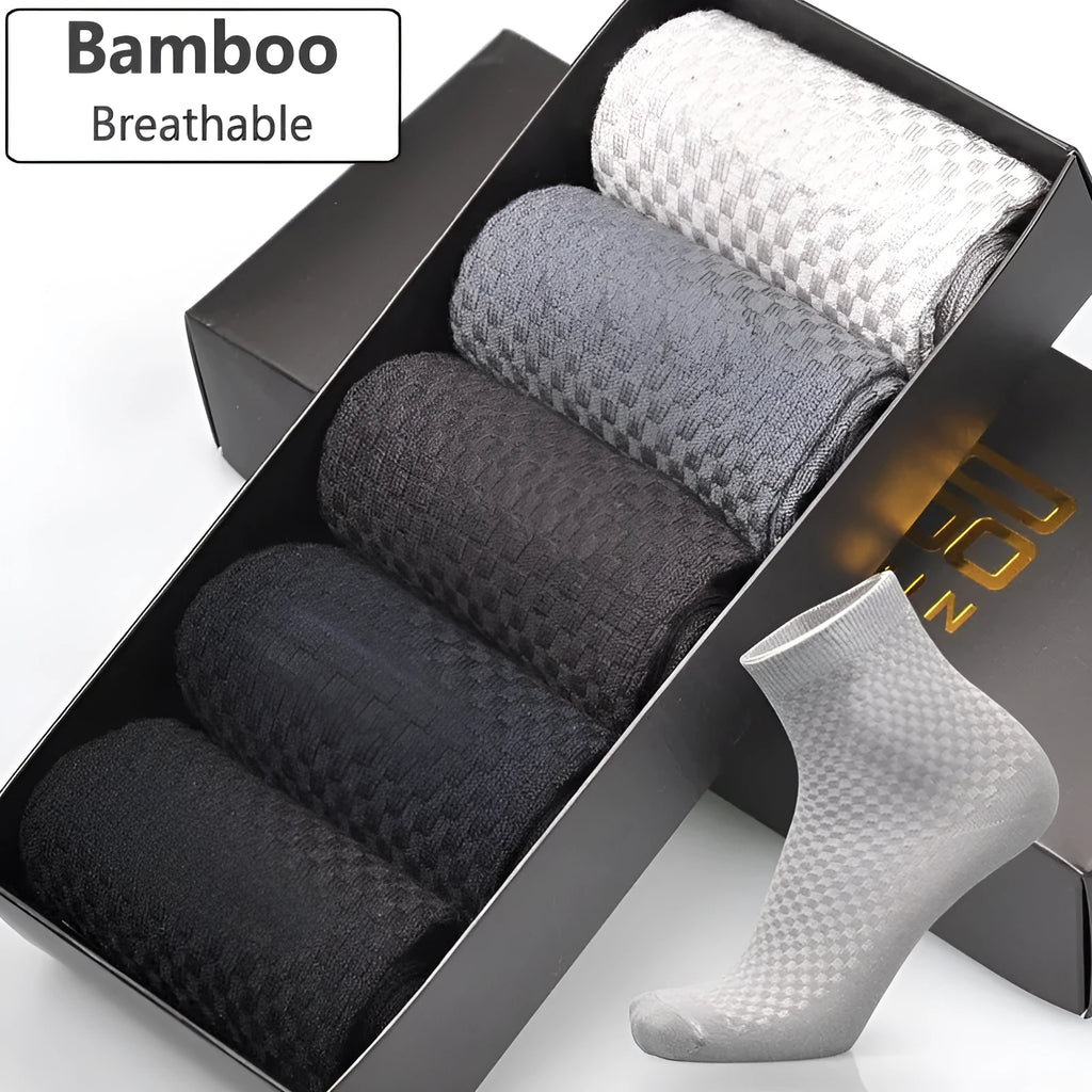 Men's bamboo fibre business socks in small square pattern, shown in classic colours on a grey background.