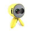 YG220 white or yellow LED projector displaying an image on a wall, showing front design and compact size.