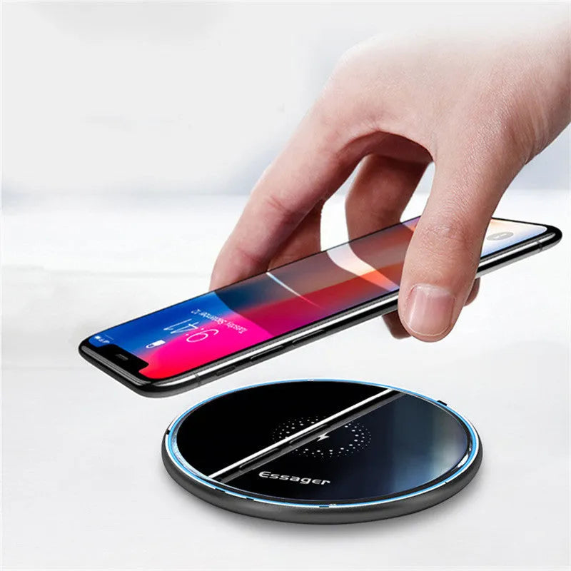 Black aluminium wireless charging pad with LED indicator light on smooth surface