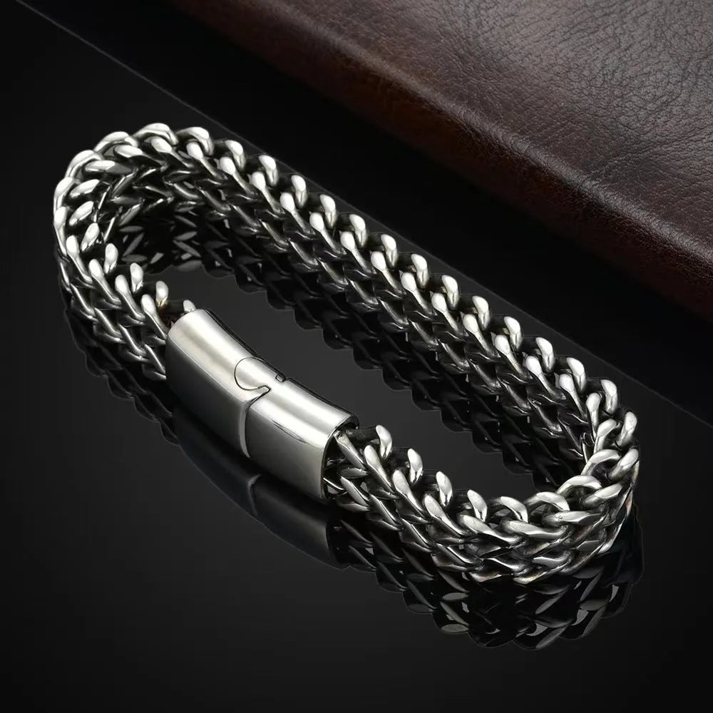Geometric stainless steel bracelet showing front and back design in silver finish