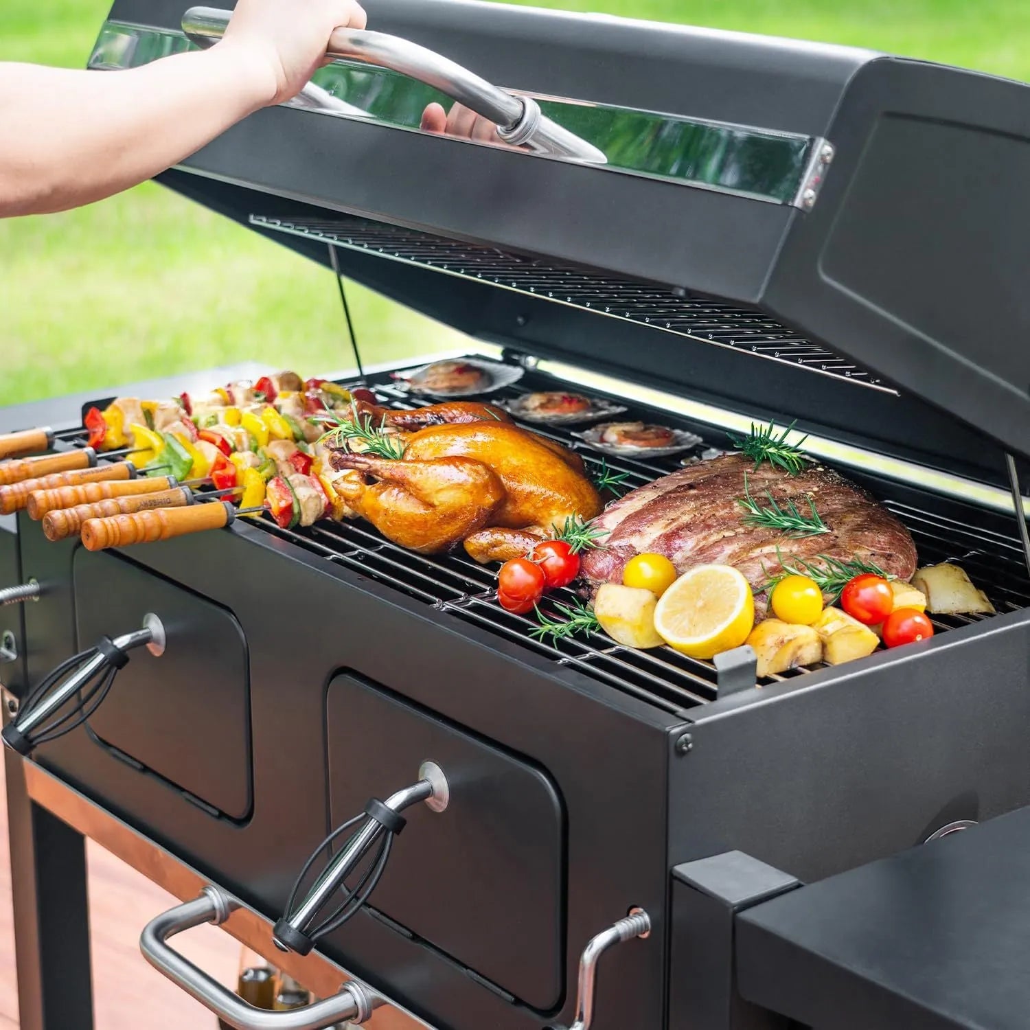 Extra large charcoal barbecue grill with foldable side tables and black metal body