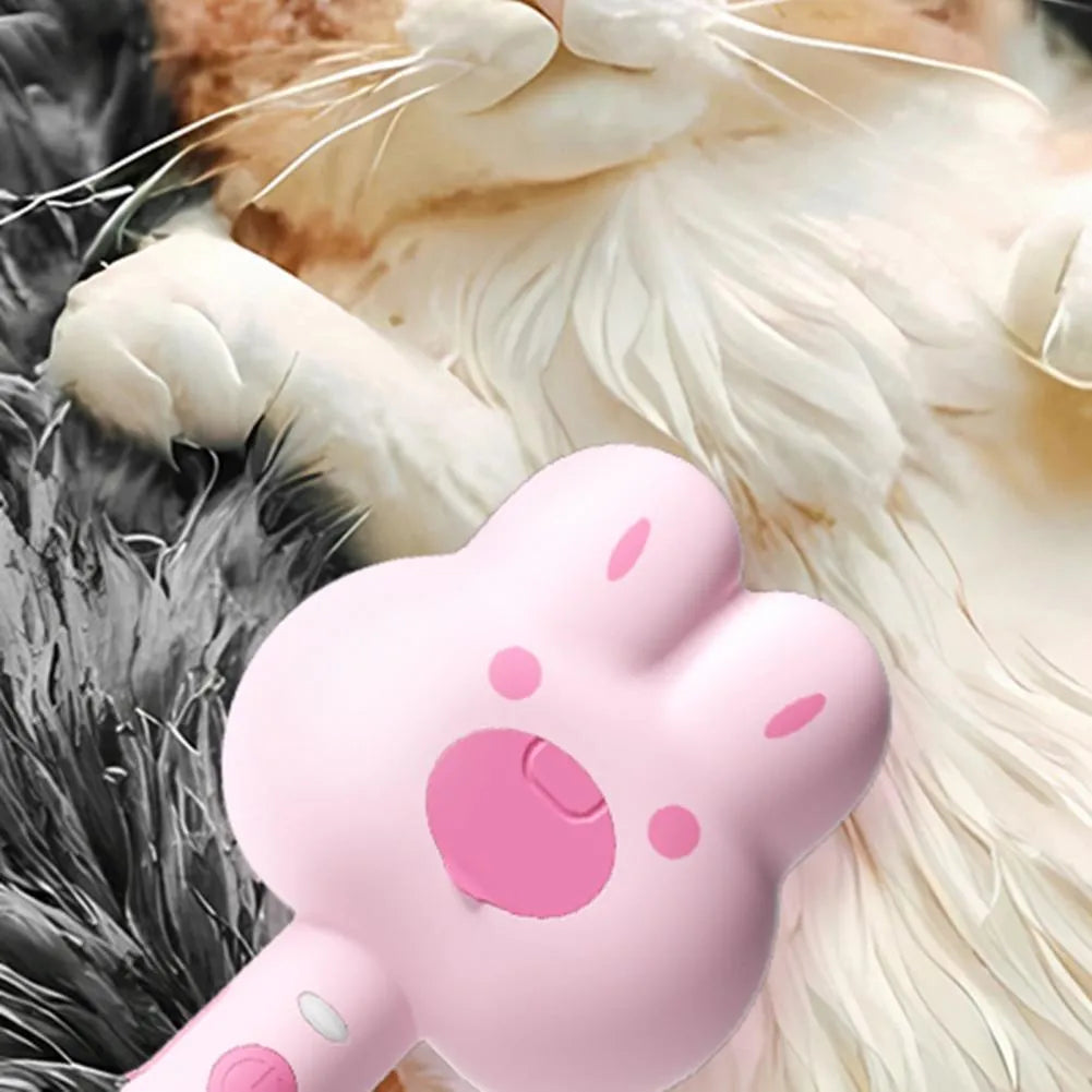 Cat steam brush grooming tool with cartoon design showing hot spray function and self-cleaning mode