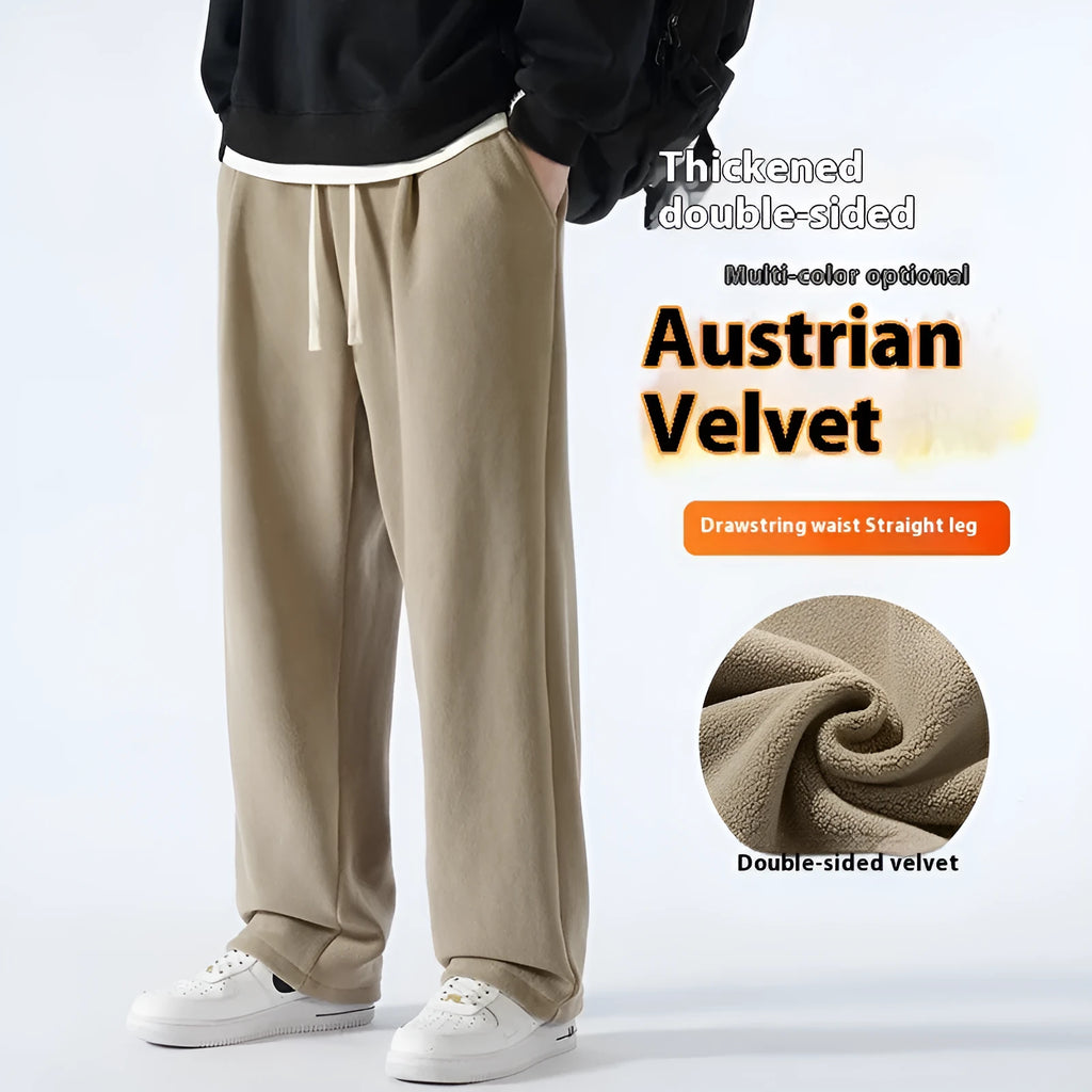 Men's double-sided polar fleece winter sports trousers in apricot colour, showing loose fit and drawstring waistband.
