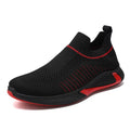 Men's black and white mesh slip-on sneakers with striped design and flat sole.
