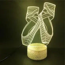 3D acrylic ballet dancer LED night light with remote control on an ABS base, showing colourful illumination.