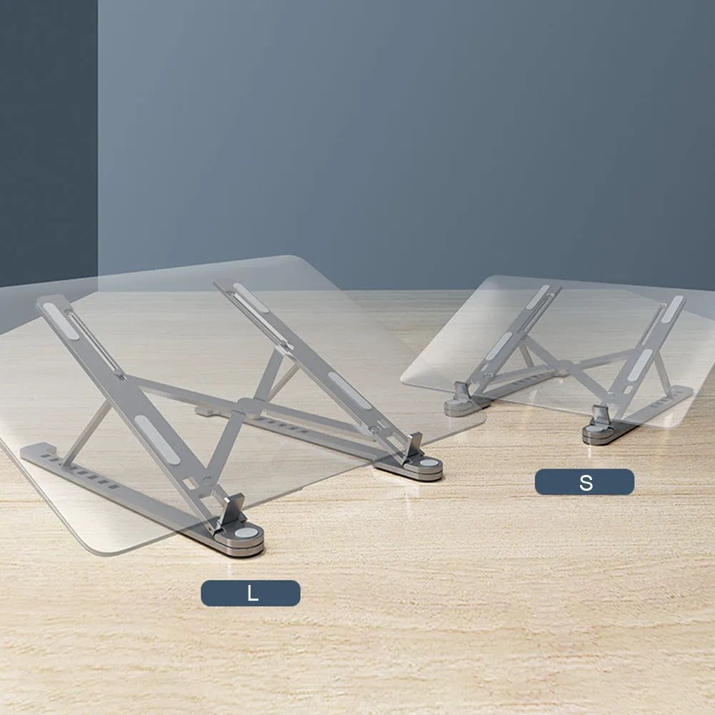 Aluminum foldable laptop stand in silver colour, shown adjusted to an elevated height with a laptop on top.