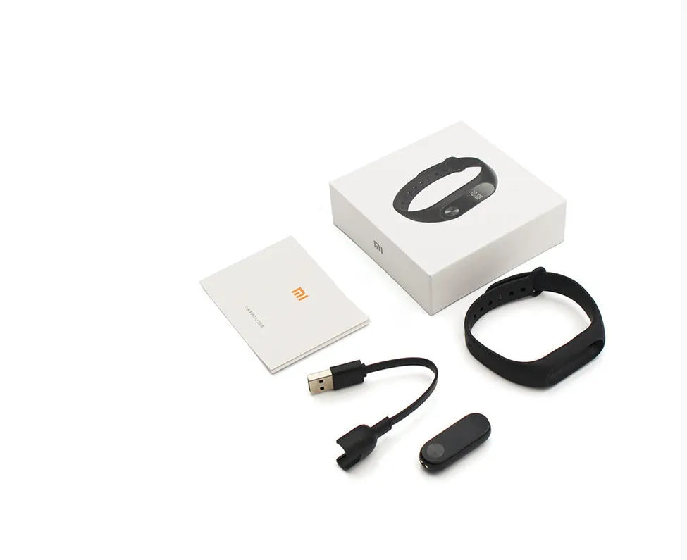 Black Xiaomi Mi Band 2 fitness tracker with OLED screen on an adjustable wrist strap